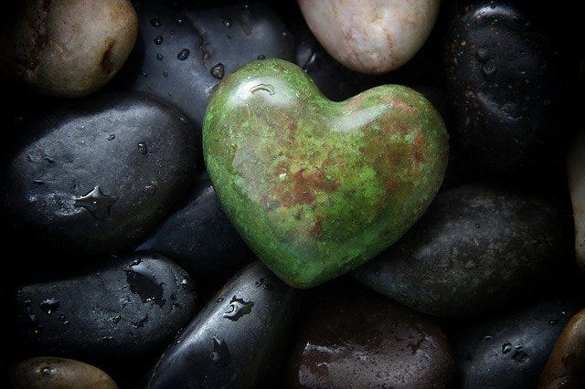 heart shaped stone, water, many stones