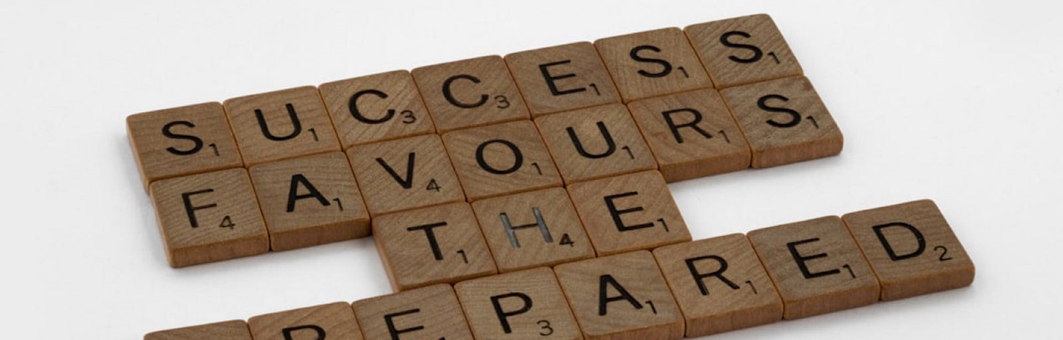 Scrabble tiles that spell “success favours the prepared”
