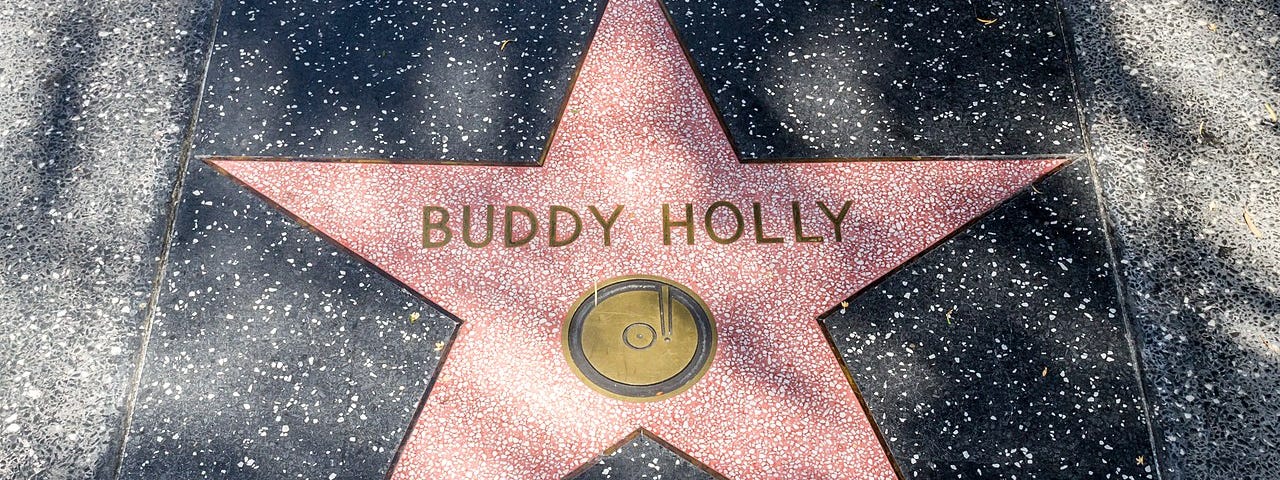 Photograph of a Pink Star “Buddy Holly” on the pavement at the Hollywood Boulevard in Los Angeles, California, USA