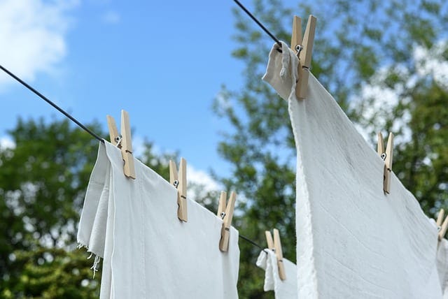 white clothes hanging on a laundry line