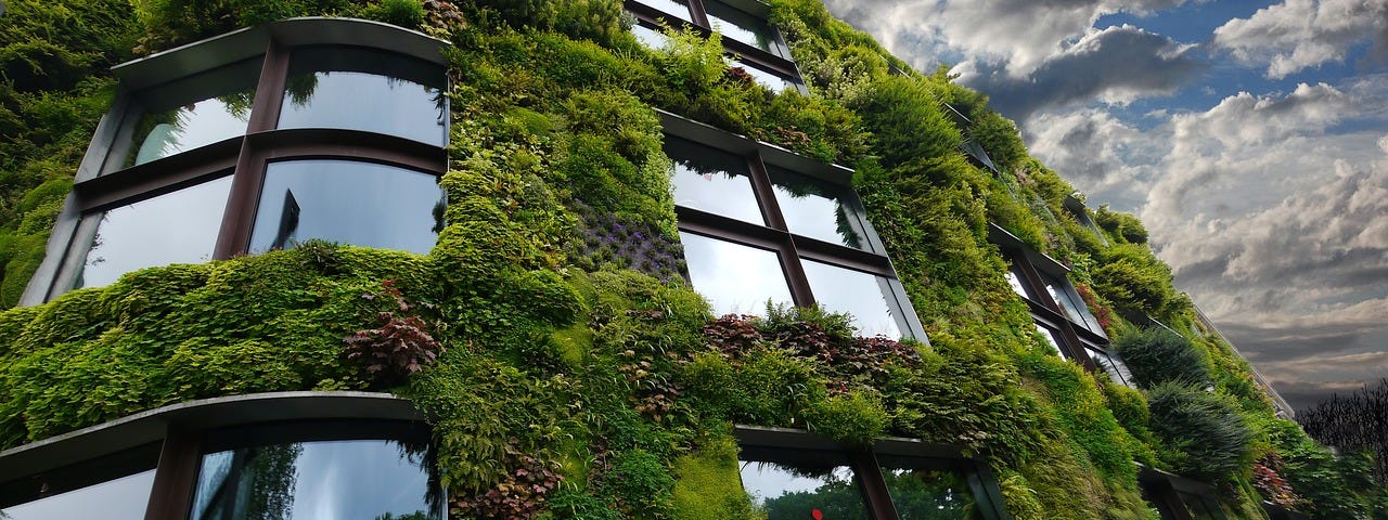 IMAGE: A building in Paris with lots of plants and greenery on its façade.