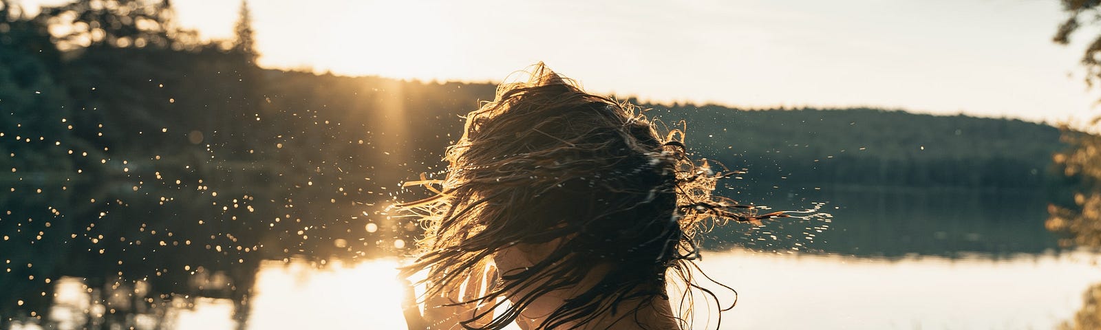 woman standing in water during daytime