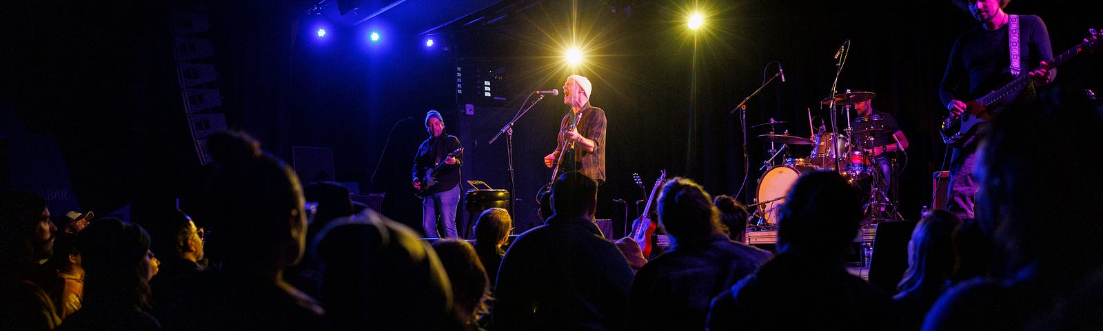 Rocky Votolato and band members perform for concert goers.