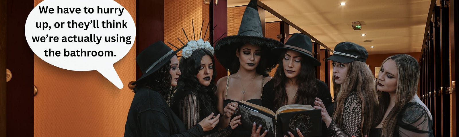 Women in a bathroom dressed in witchy outfits to show they are a coven casting spells. One is suggesting they hurry up before their dates suspect they might be actually using the restroom to relieve themselves.