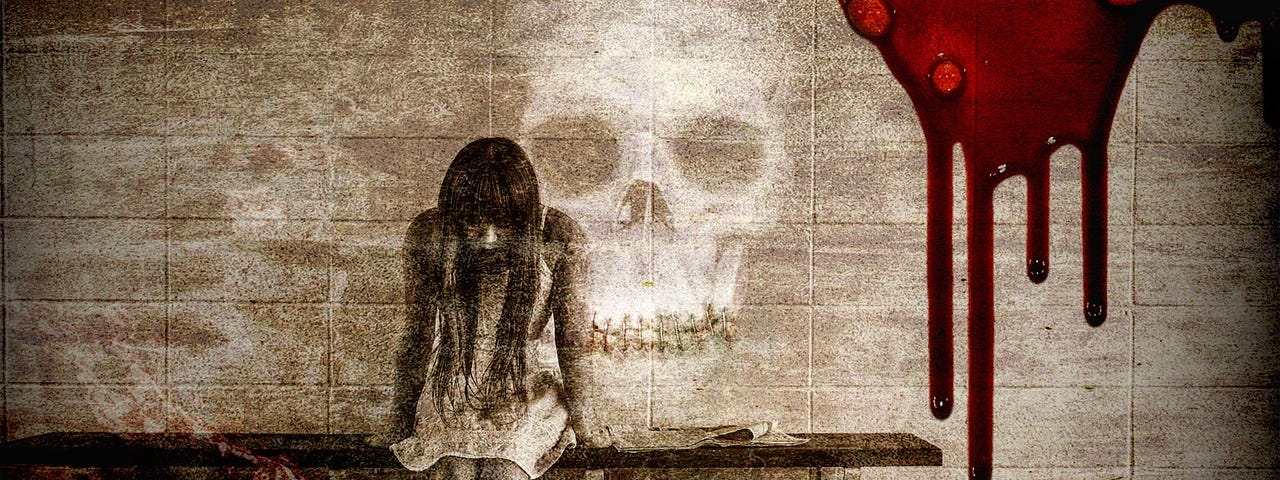 A woman sitting on a bench, lost in despair. On the wall behind her is a skull and blood running down the side of the wall.