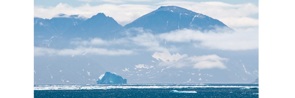 Icebergs drift along near Ramah Bay in Torngat Mountains National Park in Labrador in eastern Canada. (story and all photos © April Orcutt — all rights reserved)