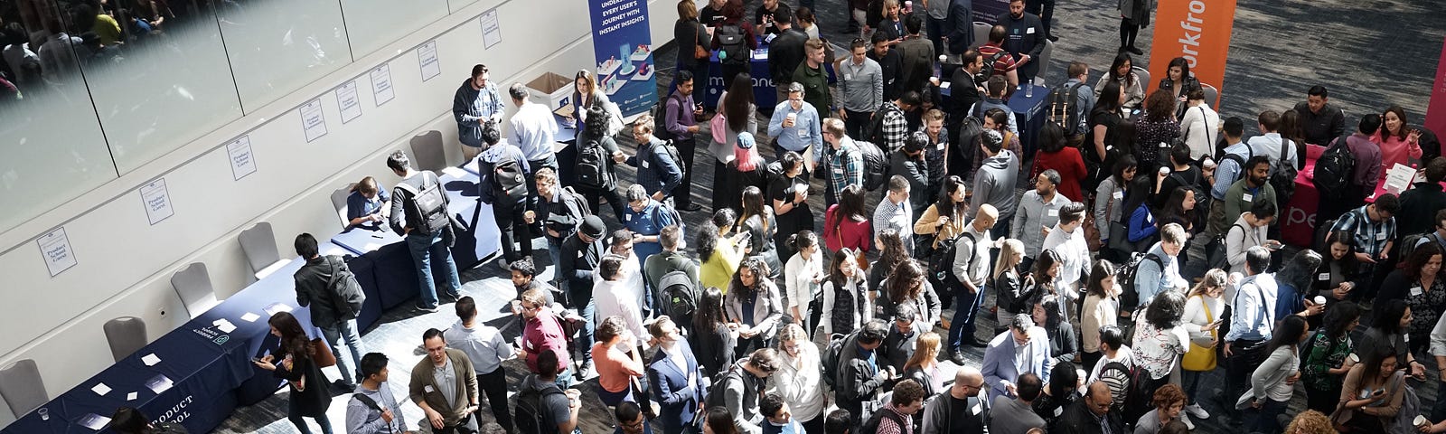 Crowd of people in building lobby