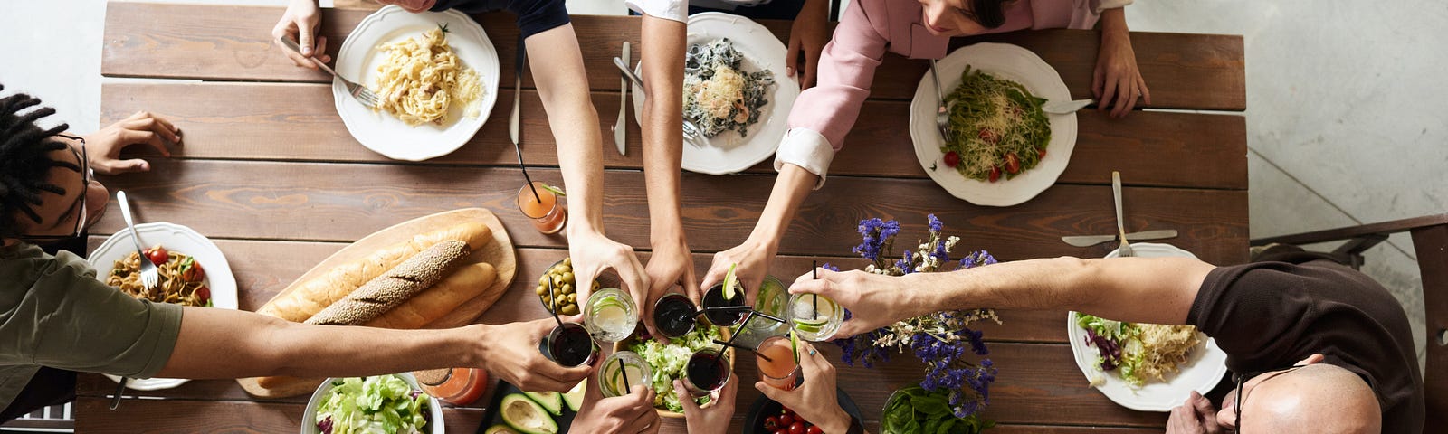 Group of people making toast