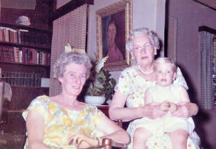 An older woman, a middle-aged woman, and a baby.