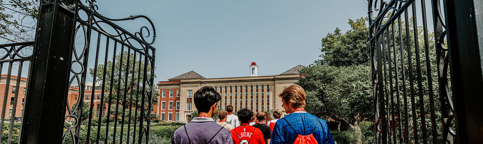 Students walk toward Love Library during a campus tour