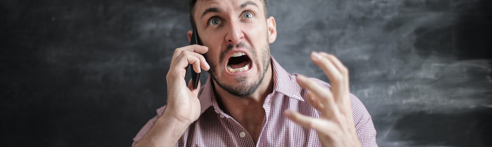 Man frustrated with social security disability benefits on the phone.