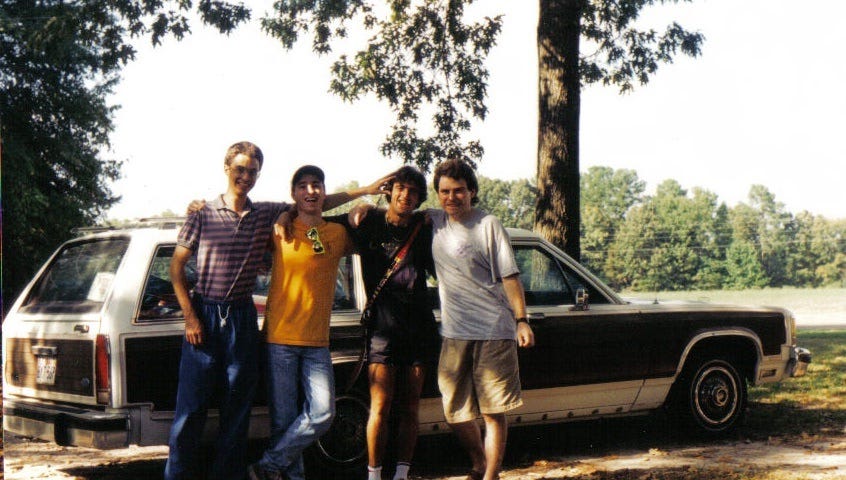 Four adventurers in front of station wagon. Photo by Author.