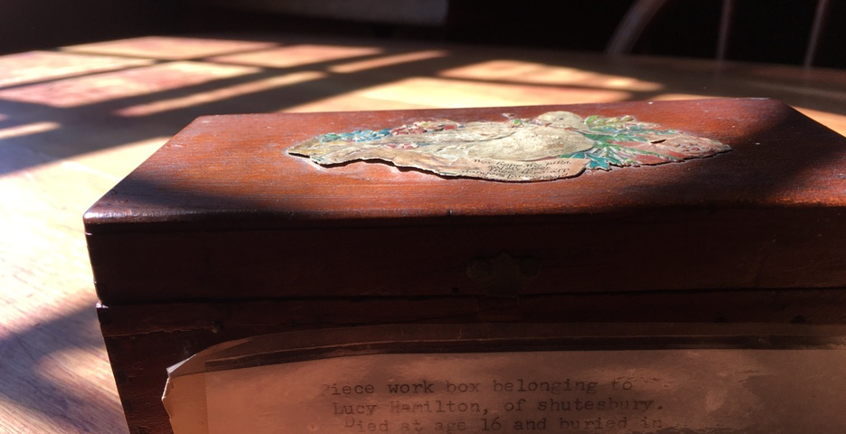 a photo of a sewing box in light and shadow
