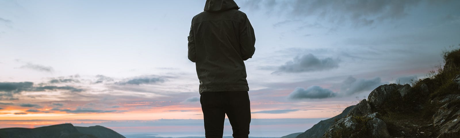 A hiker staring off into the distance.