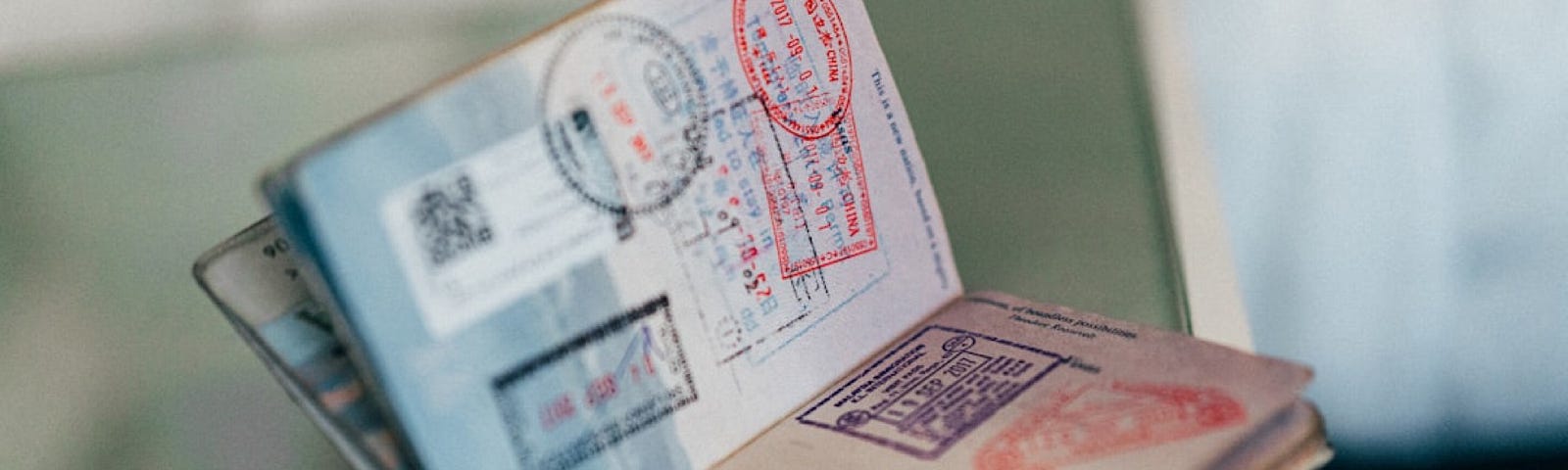 Open passport with many stamps