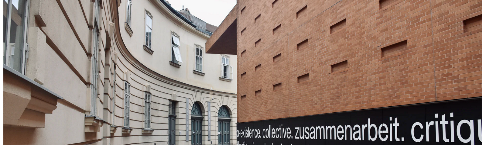 Brown brick building with writing