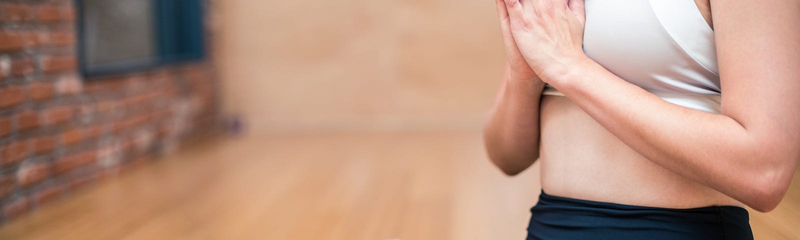 Woman sitting in full lotus yoga pose