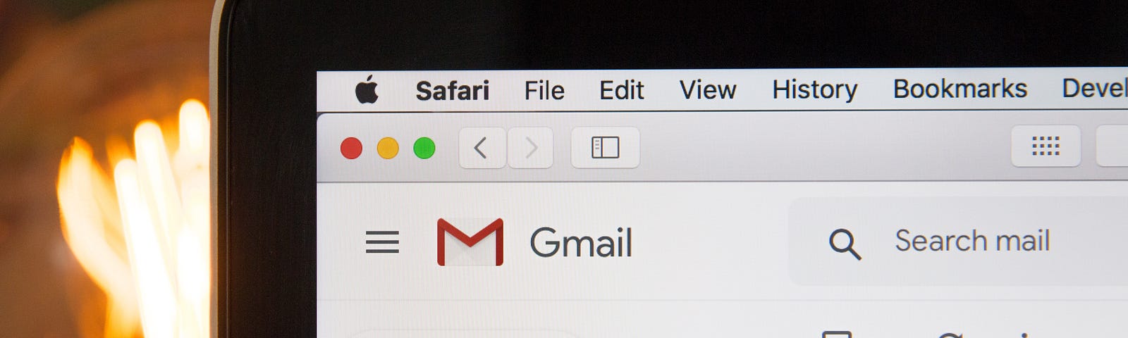 a laptop displaying the gmail email page.