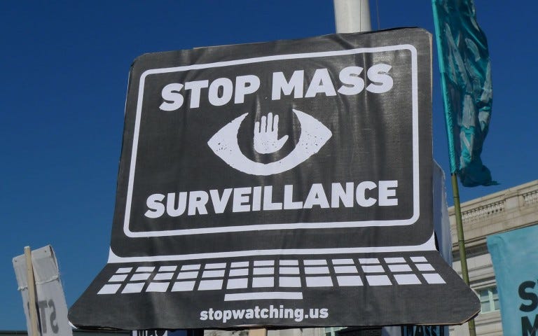 A laptop with the screen saying Stop Mass Surveillance