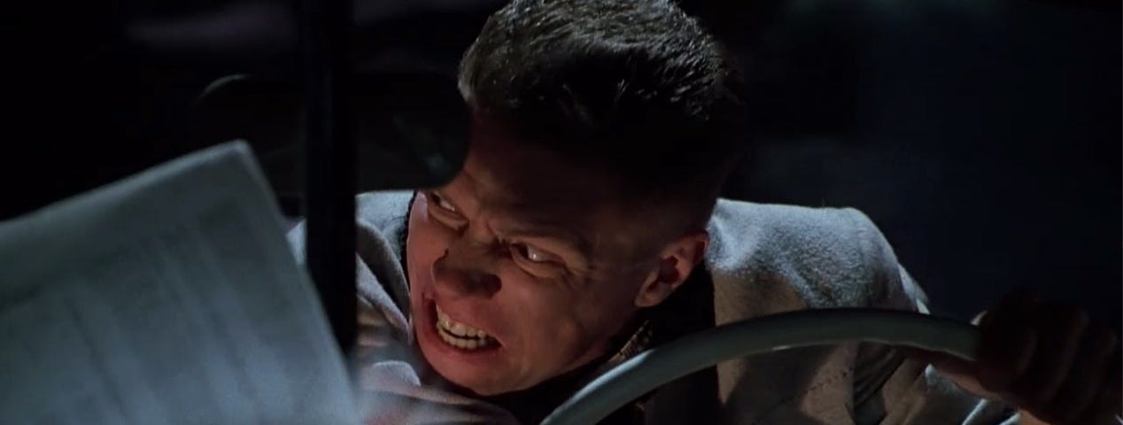 Biff, driving his car with the almanac flapping on the windshield, sneers at Marty.
