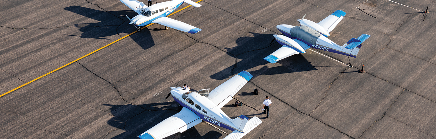 Photo of small airplanes on the tarmac.