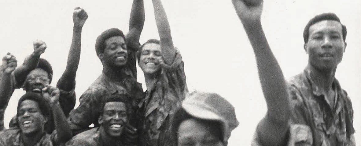 African American Soldiers in the 1960’s raising their fists for a group photo