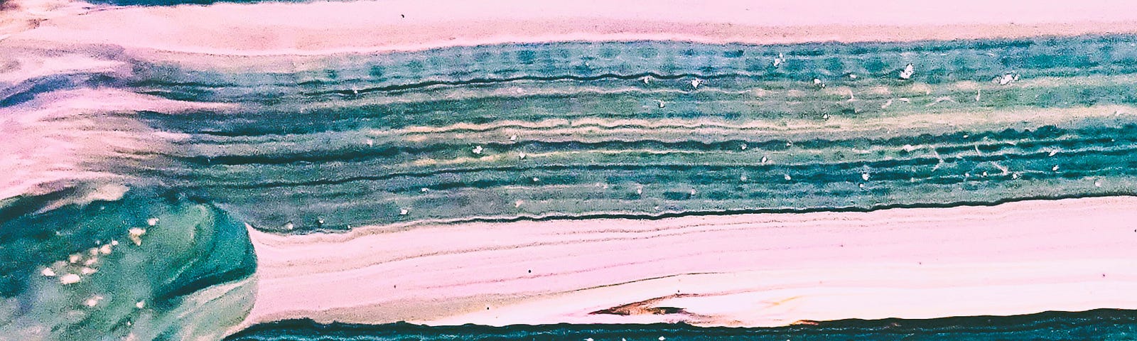 Close up photo of an abstract painting- there are pinks, blues, and blacks