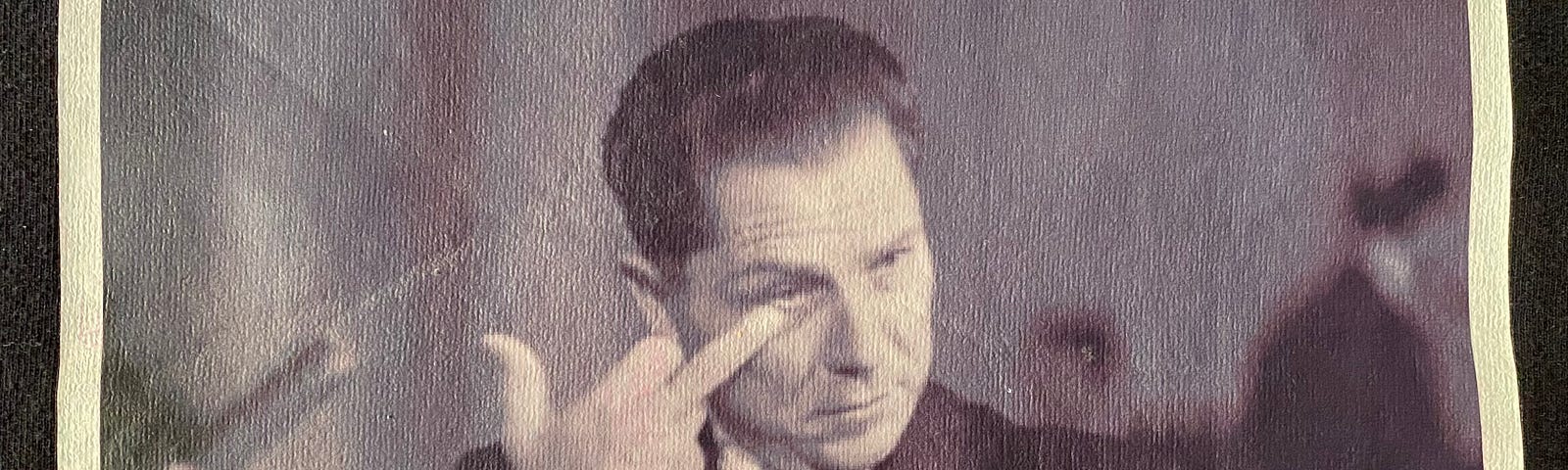 black & white image of Jimmy Hoffa holding up his middle finger printed on a t-shirt