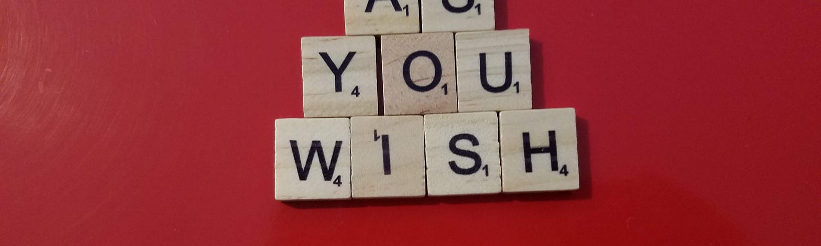 Wooden and plastic tiles spelling out “As you wish 37”