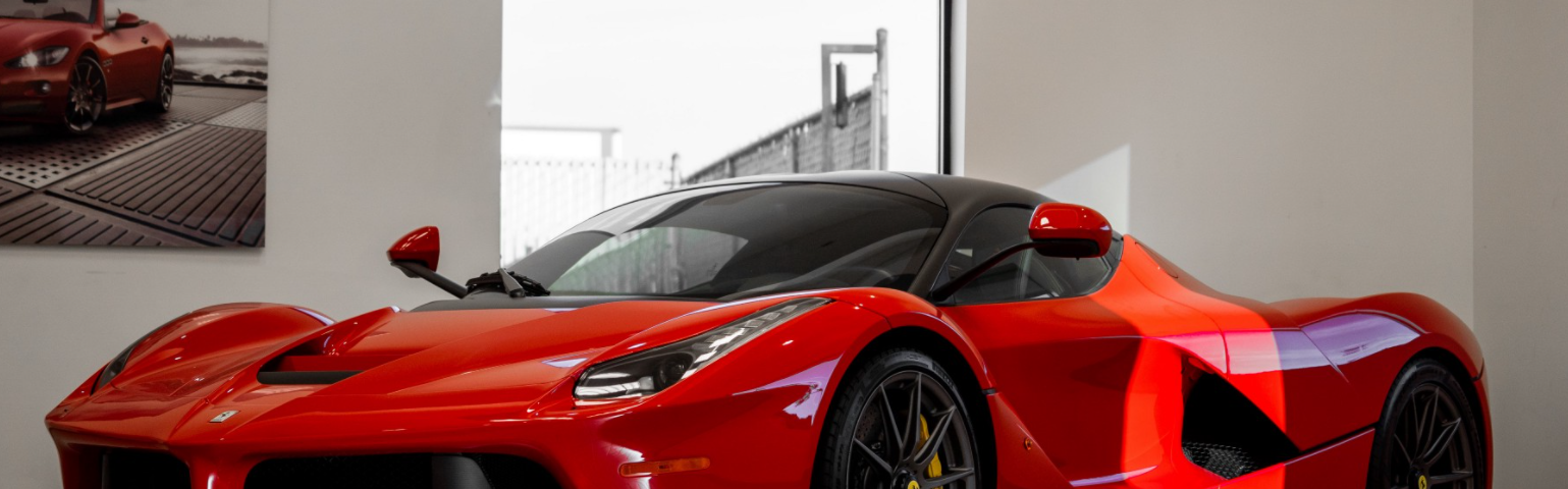 Red Ferrari in a luxury home garage