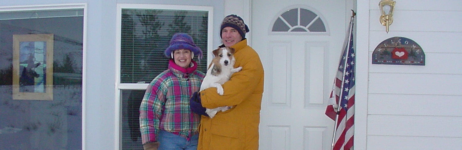 My husband Randy and I holding our puppy, Kramer outside on our front porch.