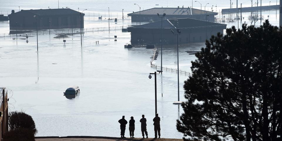 Floodwaters swallowed at least 30 buildings at Offutt Air Force Base, home of U.S. Strategic Command.