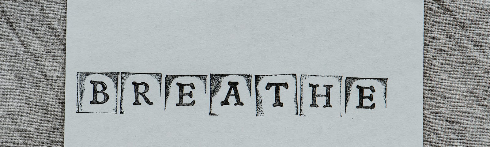 The word breathe on white paper