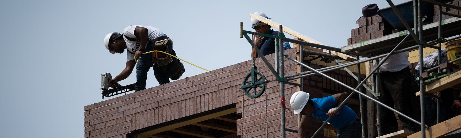 Construction workers at a residential property in Washington, D.C., August 25, 2022. Photo by Graeme Sloan/Reuters