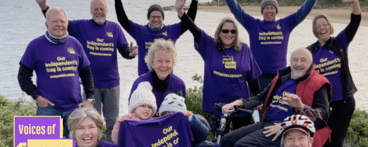 A group of Voices of Goldstein members cheering at the camera, all wearing purple t-shirts that read ‘Our Independents day is coming’