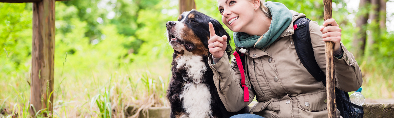 Woman smiling with her dog in nature in Divorce Got You Down? The One Decision That Changed Everything for Me