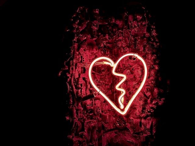 a red glowing broken heart.