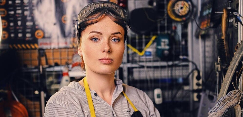 This shows a woman working in a factory.