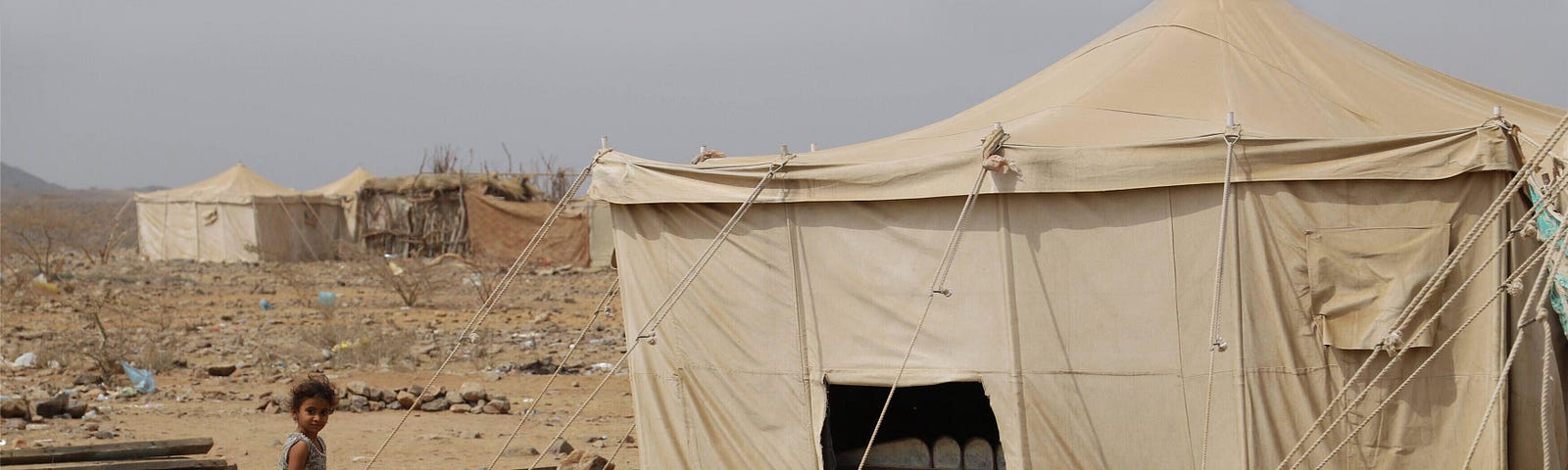 A child plays at a camp of displaced people in Harad District, Yemen, March 3, 2020. Photo by Mohammed Alwafi/Xinhua/Alamy