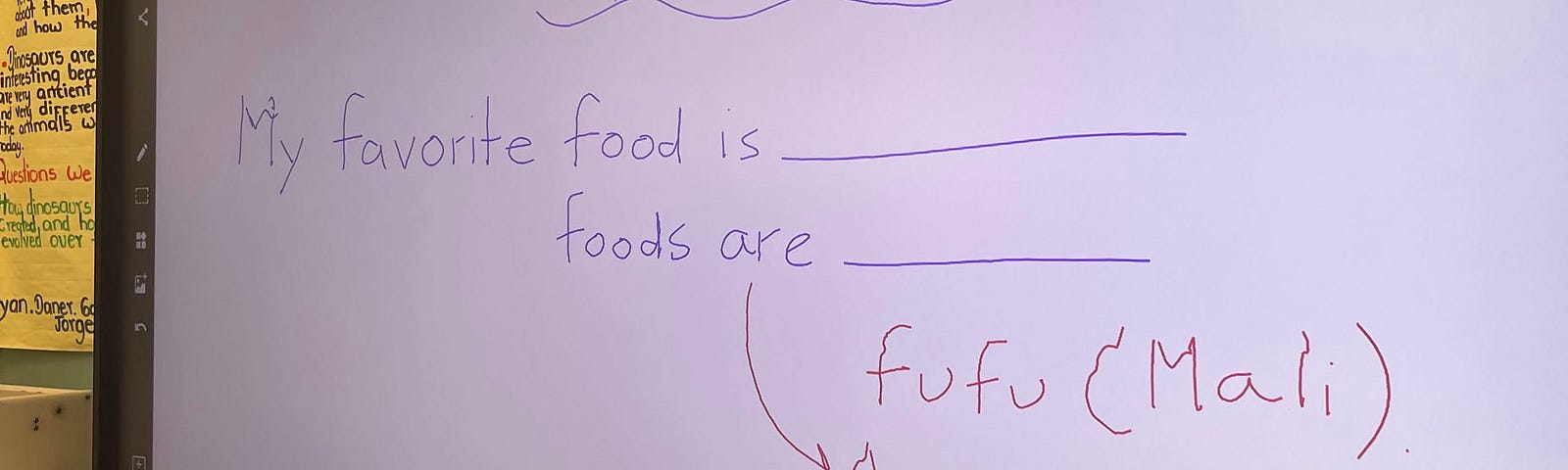 A classroom whiteboard with sentence frames about food for multilingual learners.