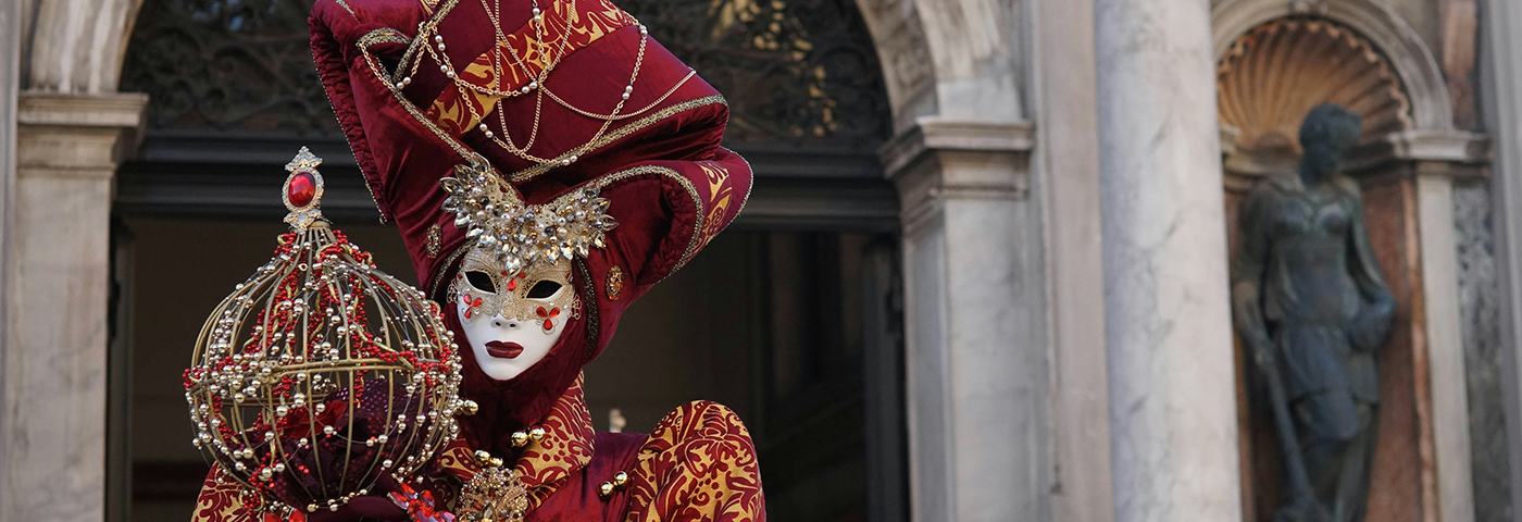 Woman in elaborate Carnevale costume.