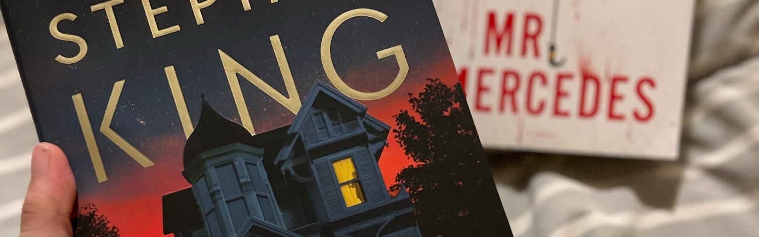 Stephen King’s new book, Holly, and the Mr. Mercedes book in the background