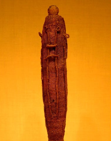 A sacred god figure wrapping for the war god ‘Oro, made of woven dried coconut fibre (sennit), which would have protected a Polynesian god effigy (to’o), made of wood. The mana of the god was symbolised by feathers, usually red in colour, which were attached to the surface of the woven covering. Figure held at the Metropolitan Museum of Art in New York.