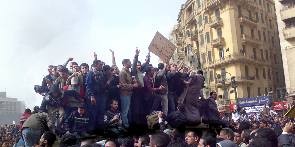 This picture displays demonstrators on an army truck in Tahrir Square in Cairo, Egypt in 2011.