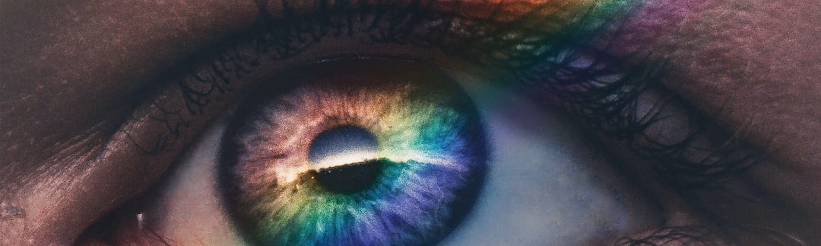 A rainbow passing over an eye.