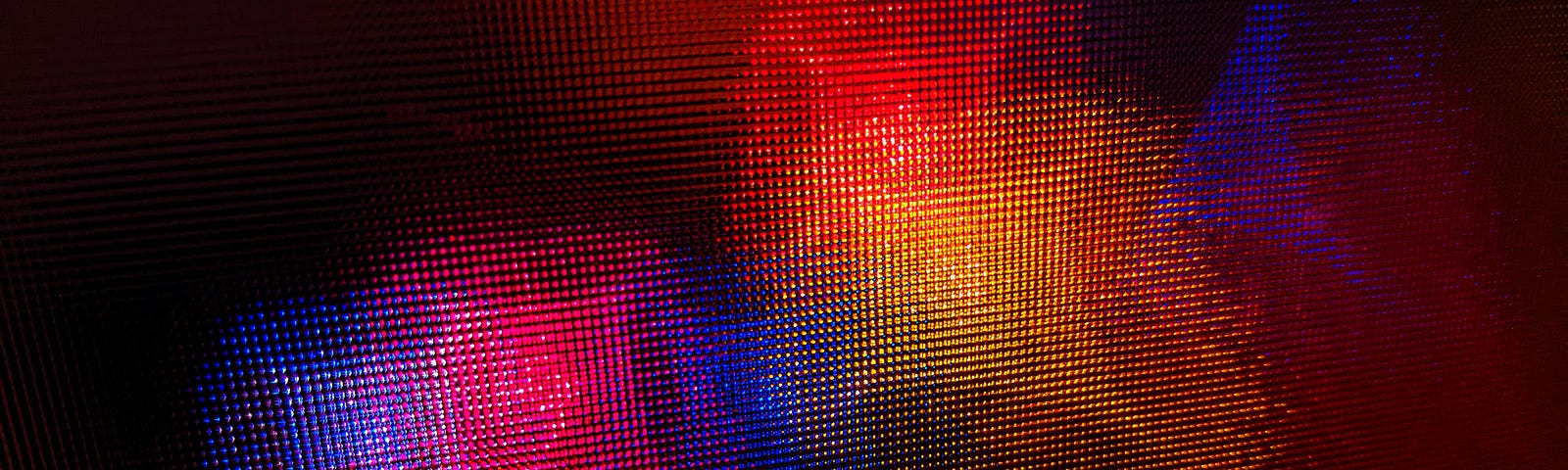 Multi-colored lights that looked blurred by a semi-transparent cover or window.