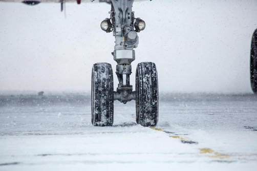 Aircraft wheel on a snowy runway