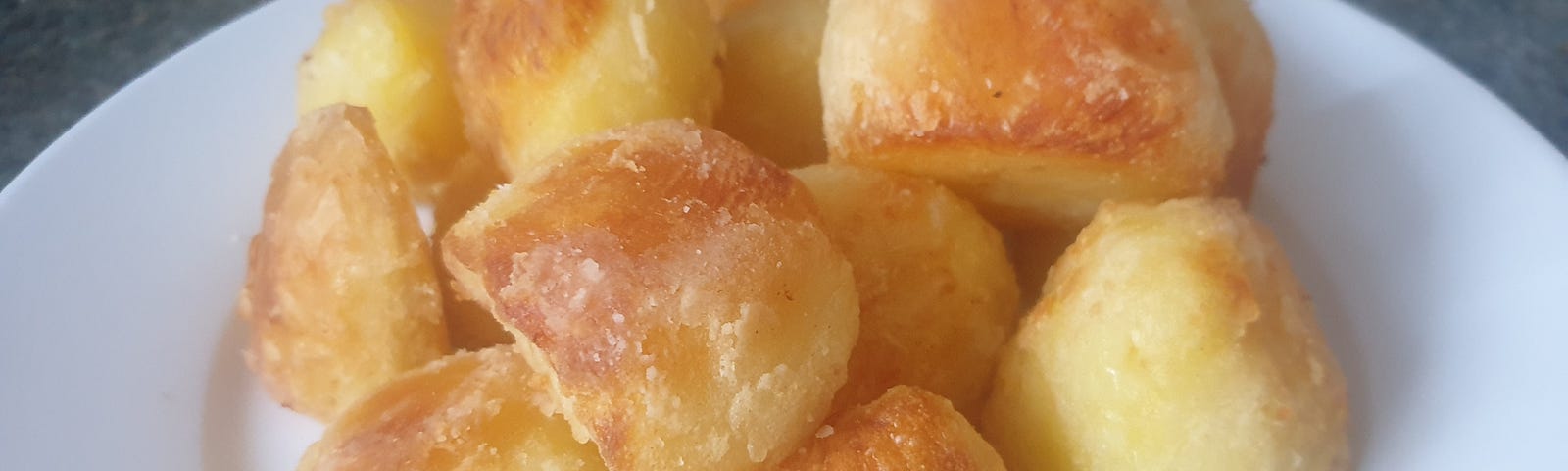 A plate full of crispy roast potatoes