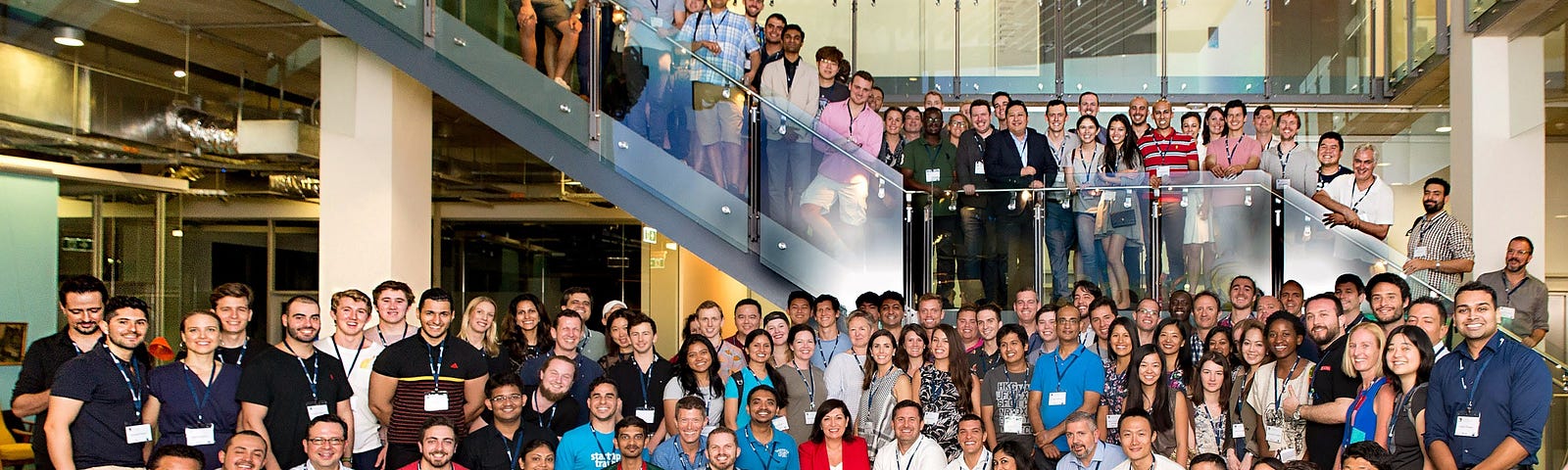 Group photo of more than 100 adults wearing nametags.