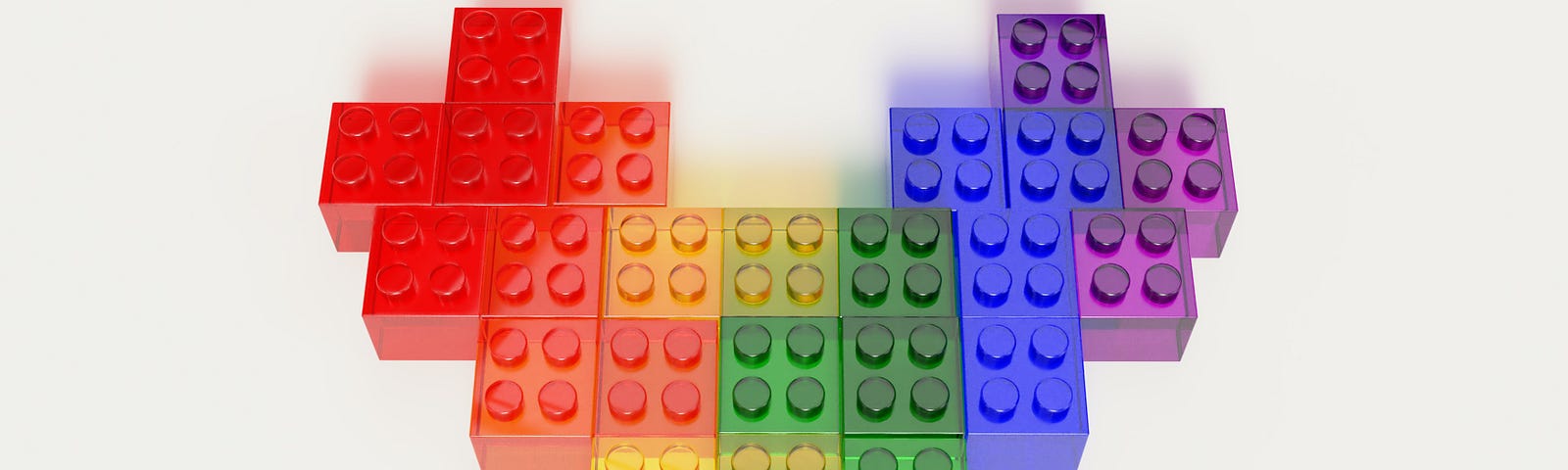 Image of a heart shape made out of LEGO blocks in rainbow colors.